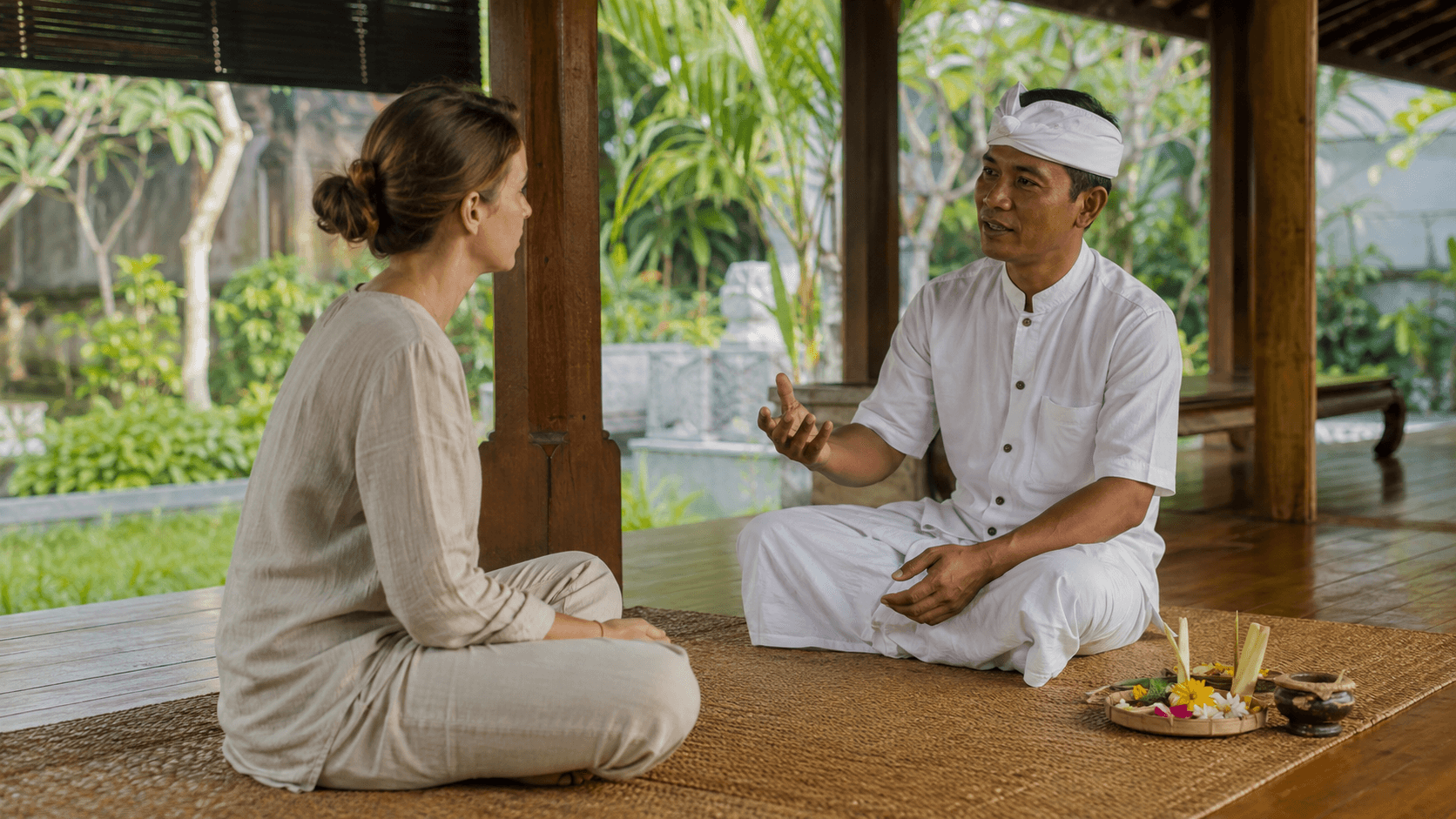Guest listening during a respectful consultation with a traditional Balinese practitioner