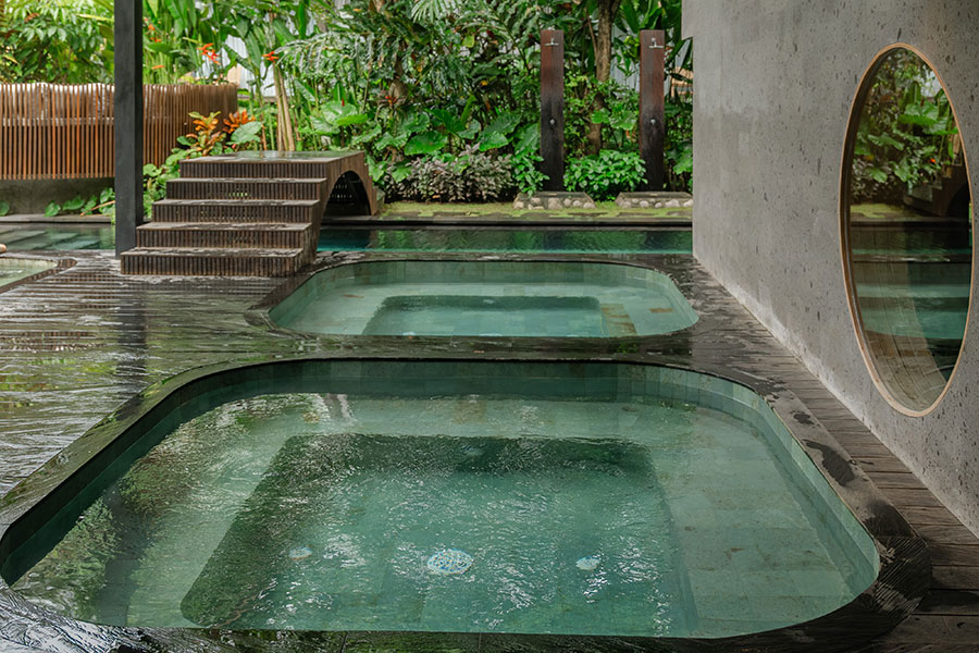 Hydrotherapy pools in a green Bali wellness setting