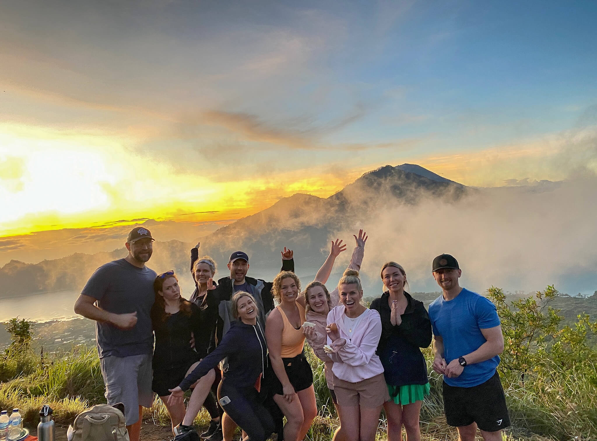 Retreat group hiking to a mountain sunrise in Bali during a 6-day retreat